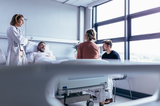 man in hospital bed